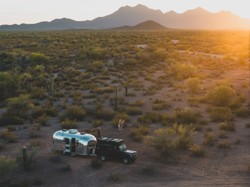 Land Rover Defender with Airstream at cactus