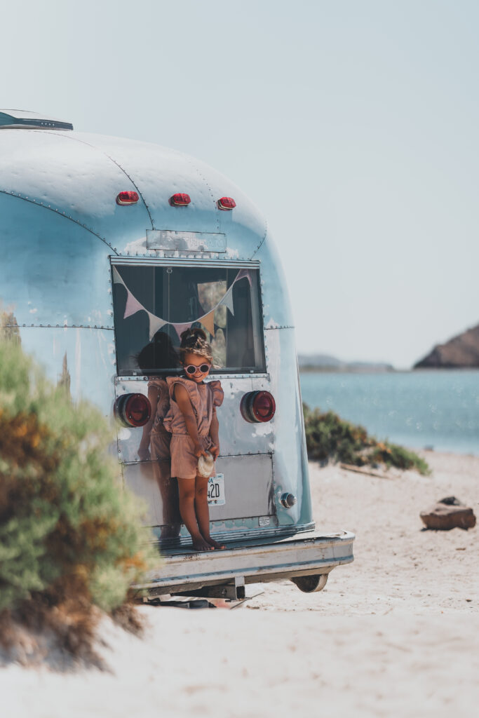 Lovi at the back of a Vintage Airstream